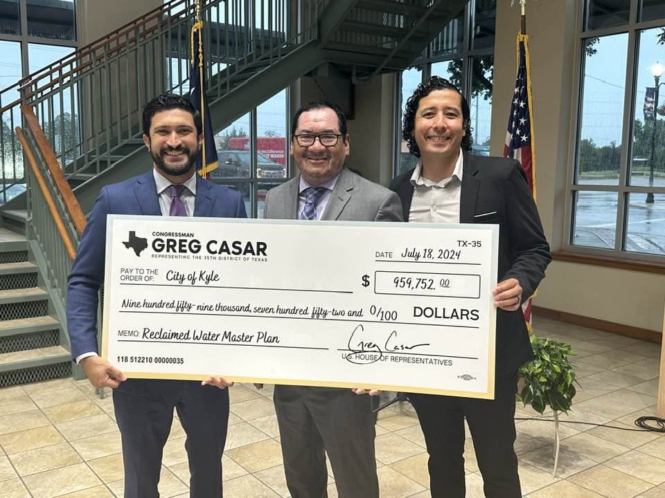 Robert Rizo with Congressman Greg Casar during a presentation of federal funding for Kyle water infrastructure